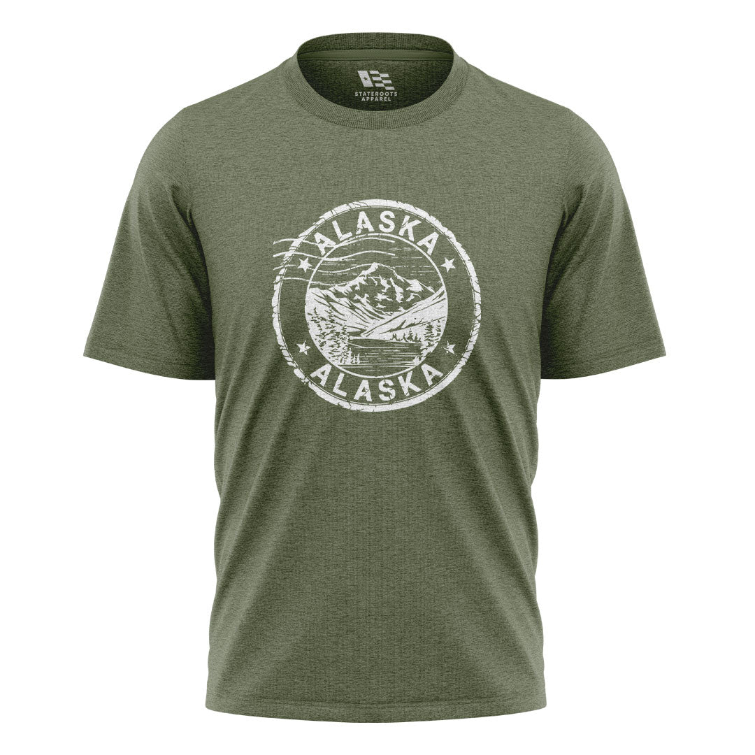 Alaska Distressed Stamp Mountain Badge - Military Green flatlay